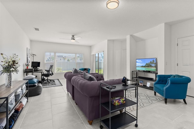 tiled living room featuring ceiling fan