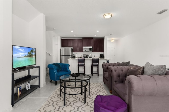 4919 Conifer Cone Dr, Kissimmee, FL 34746 - living room featuring light tile patterned flooring and recessed lighting