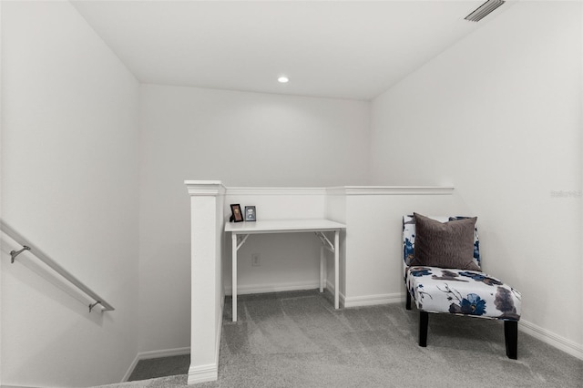 sitting room with light colored carpet