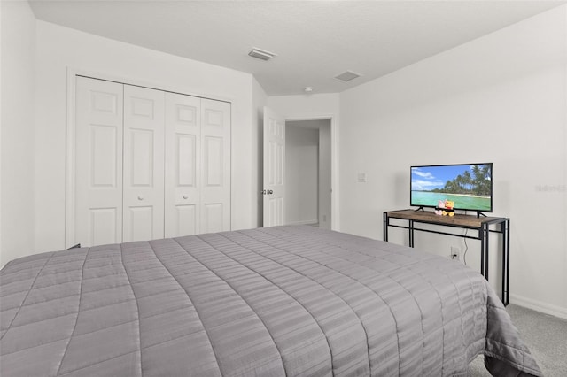 bedroom featuring a closet and carpet floors