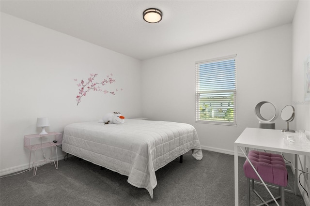 4919 Conifer Cone Dr, Kissimmee, FL 34746 - bedroom featuring dark colored carpet and baseboards