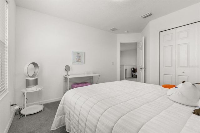 4919 Conifer Cone Dr, Kissimmee, FL 34746 - carpeted bedroom featuring a closet and baseboards