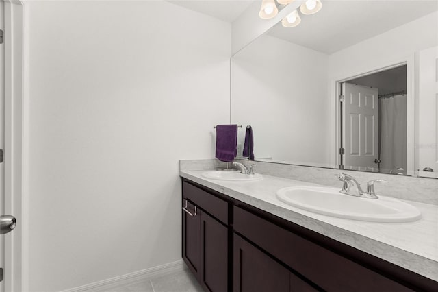 bathroom with vanity and tile patterned flooring