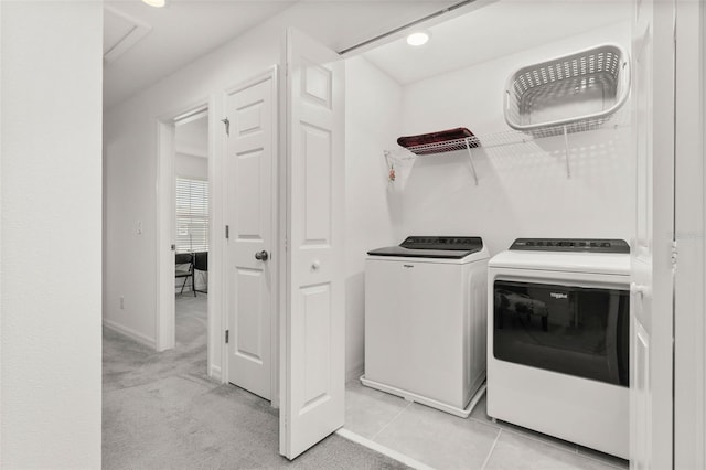 4919 Conifer Cone Dr, Kissimmee, FL 34746 - laundry area with washer and dryer, baseboards, and light colored carpet