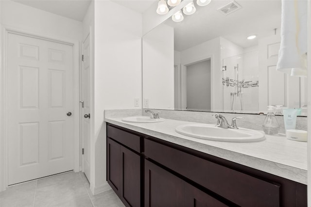 4919 Conifer Cone Dr, Kissimmee, FL 34746 - full bathroom with tile patterned floors, a shower stall, and double vanity