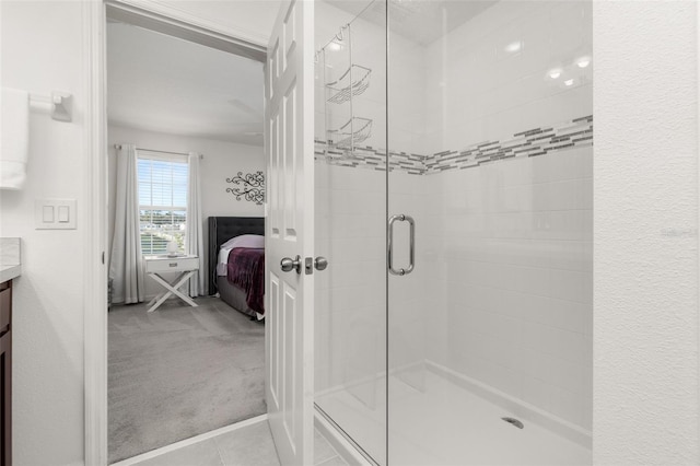 bathroom with vanity and a shower with shower door