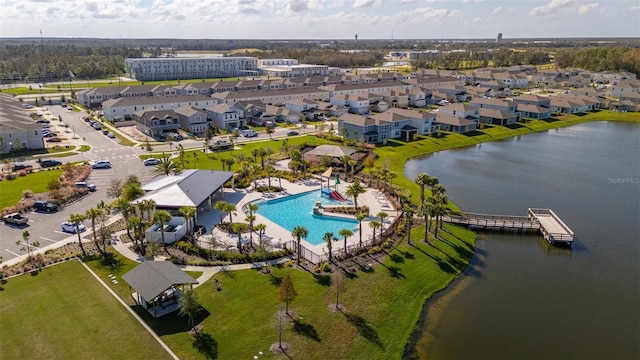 birds eye view of property with a water view