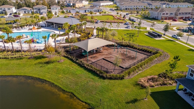 4919 Conifer Cone Dr, Kissimmee, FL 34746 - aerial perspective of suburban area with a pool and a nearby body of water