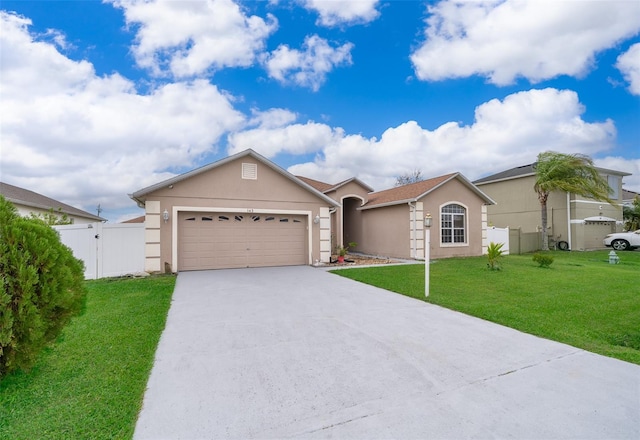 ranch-style house featuring a garage and a front yard