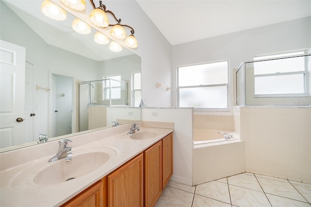 bathroom featuring vanity, tile patterned floors, and separate shower and tub