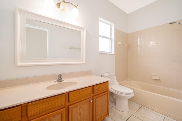 full bathroom featuring vanity, tile patterned floors, toilet, and tiled shower / bath