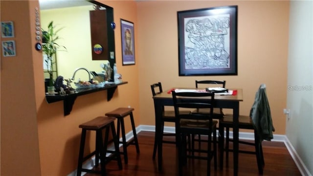 dining area featuring dark hardwood / wood-style floors