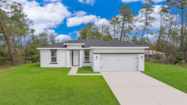 view of front of property with a garage and a front yard