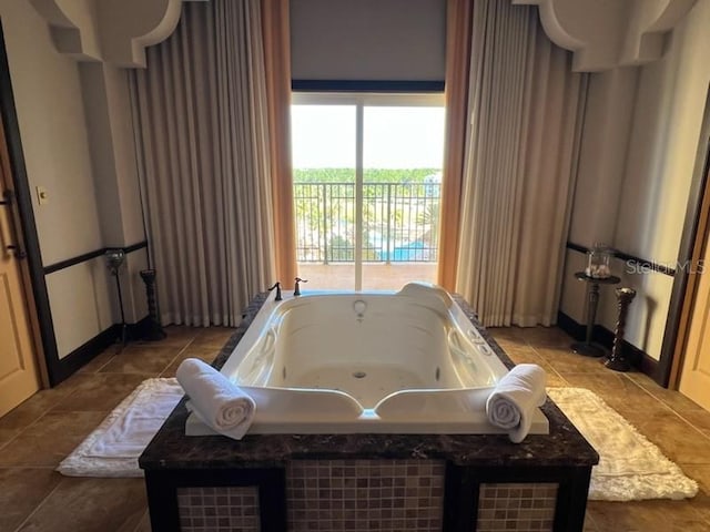 bathroom featuring a bathing tub and tile patterned flooring