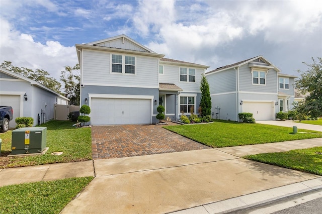 front facade with a front yard and a garage