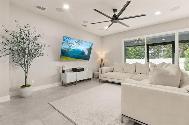 living room featuring ceiling fan and light tile patterned floors