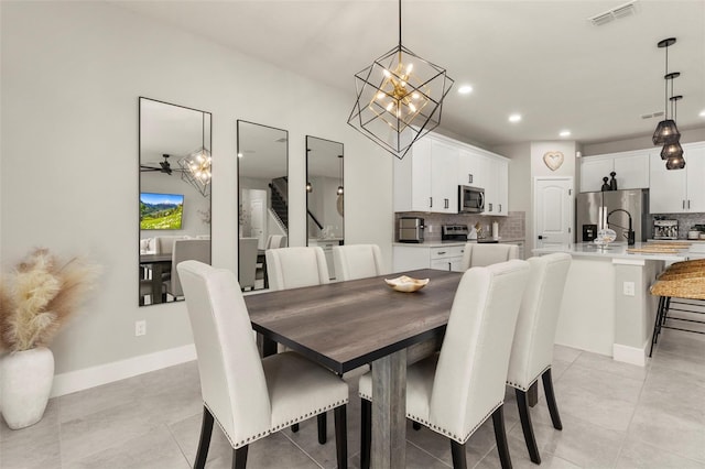 tiled dining space with ceiling fan