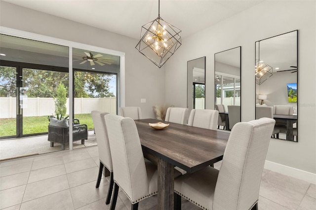 dining room featuring light tile patterned floors and ceiling fan with notable chandelier