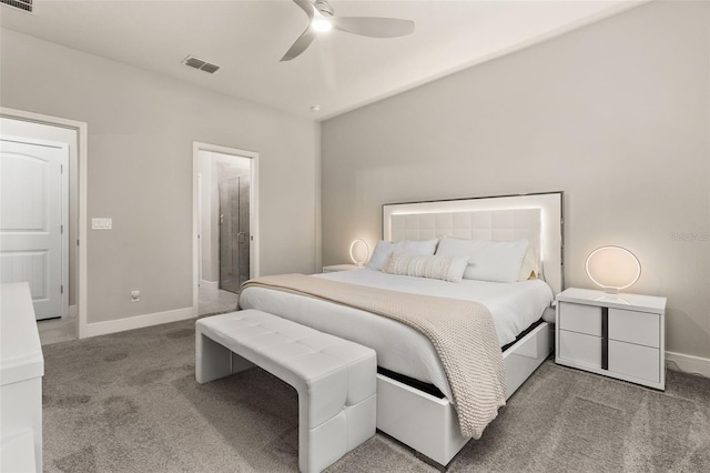 bedroom featuring connected bathroom, ceiling fan, and light colored carpet