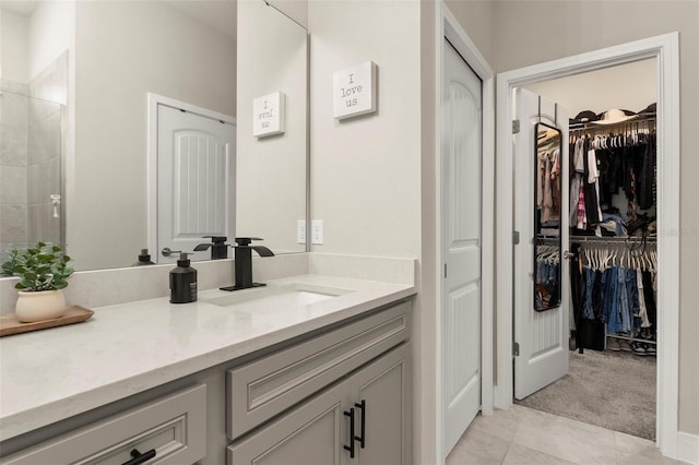 bathroom featuring tile patterned flooring and vanity