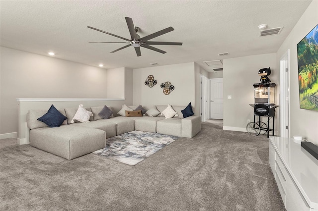 living room with carpet, ceiling fan, and a textured ceiling