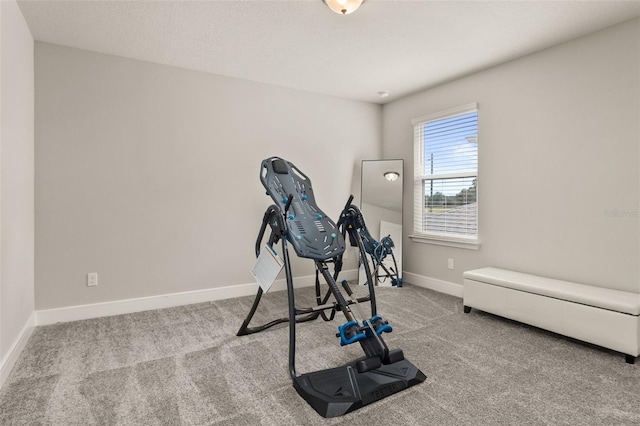 workout area featuring light colored carpet