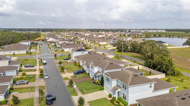 drone / aerial view with a water view