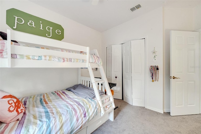 carpeted bedroom with a closet