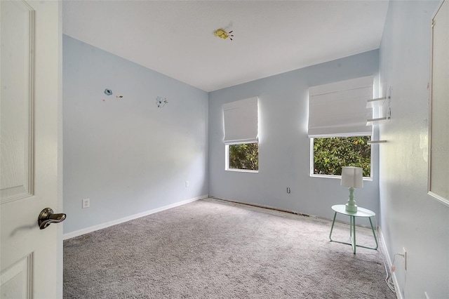 empty room with carpet flooring