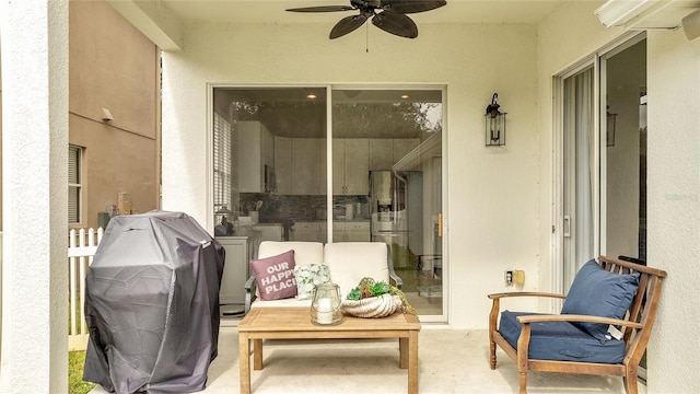 sunroom / solarium featuring ceiling fan