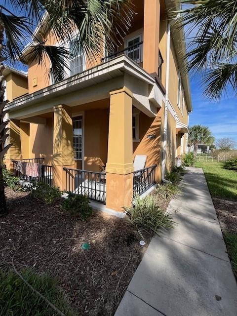 view of side of property featuring a porch