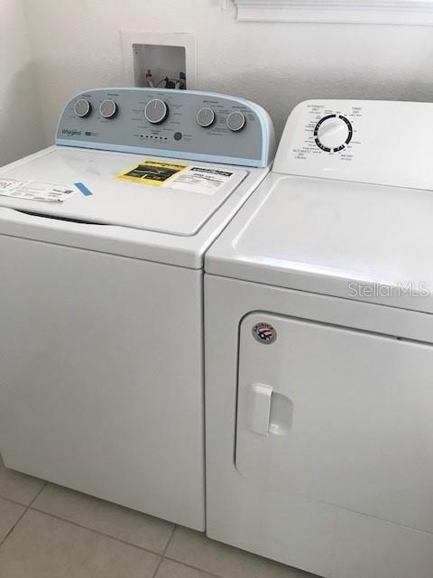 6560 Candied Peel Aly, Winter Garden, FL 34787 - laundry area featuring independent washer and dryer and light tile patterned floors