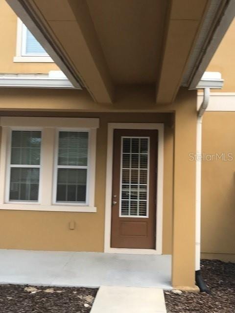 6560 Candied Peel Aly, Winter Garden, FL 34787 - entrance to property with stucco siding