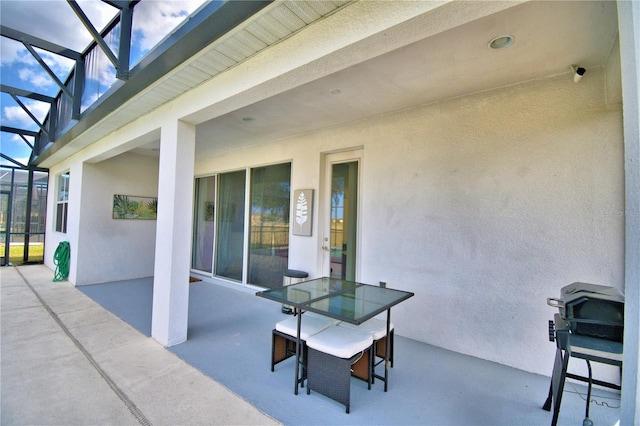 view of patio with a lanai