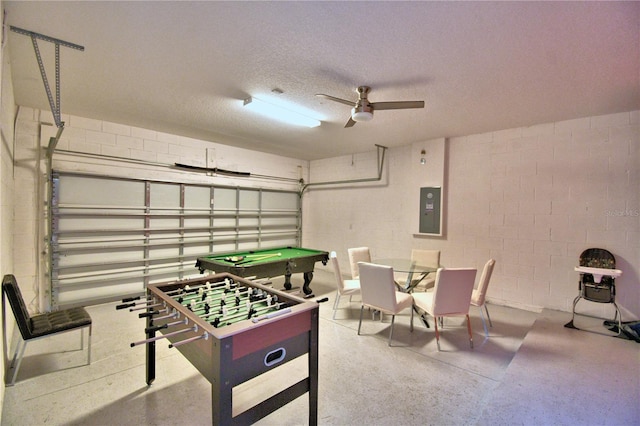 game room featuring electric panel, a textured ceiling, ceiling fan, and pool table