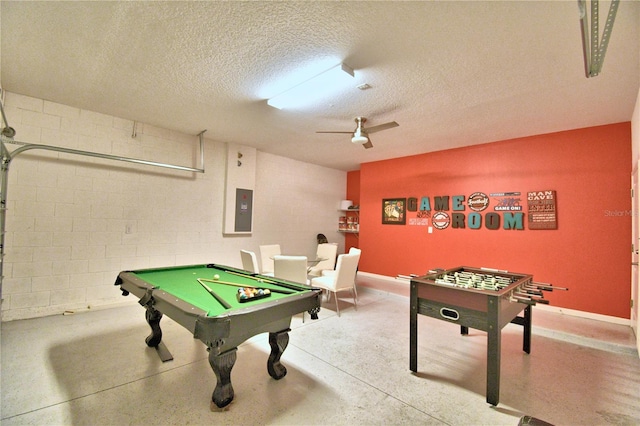 recreation room featuring electric panel, a textured ceiling, and pool table