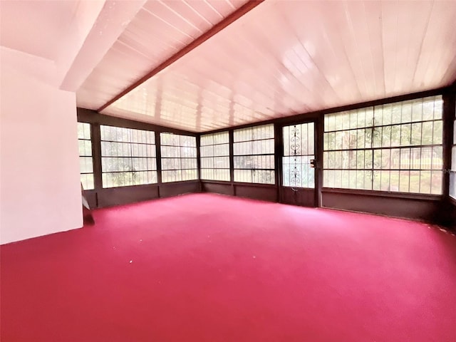 unfurnished sunroom featuring wooden ceiling and vaulted ceiling