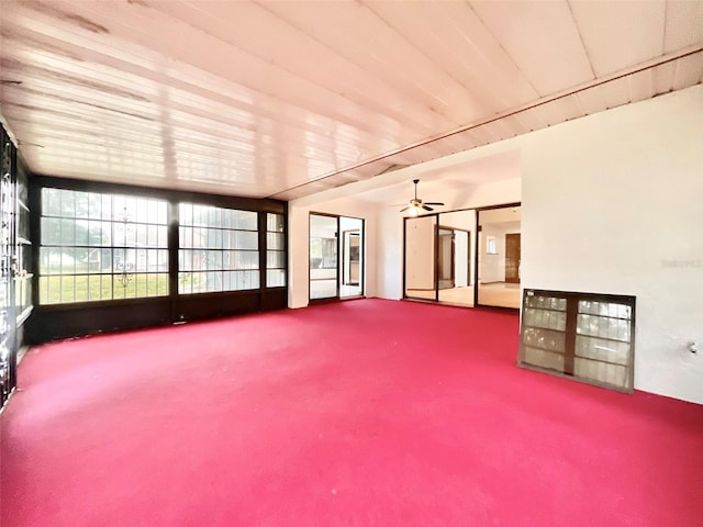 interior space with ceiling fan