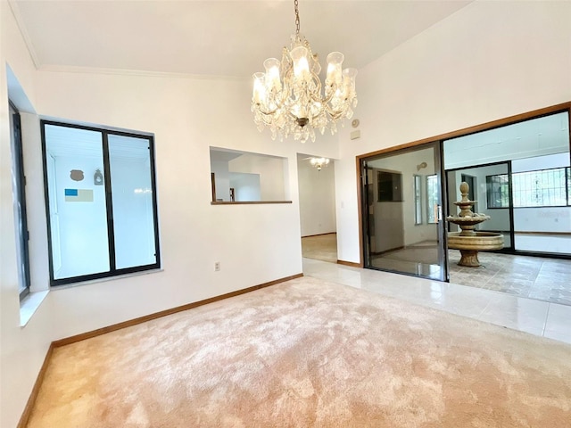 spare room with lofted ceiling, light carpet, and ornamental molding