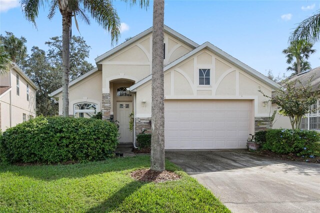 view of front facade featuring a garage and a front yard