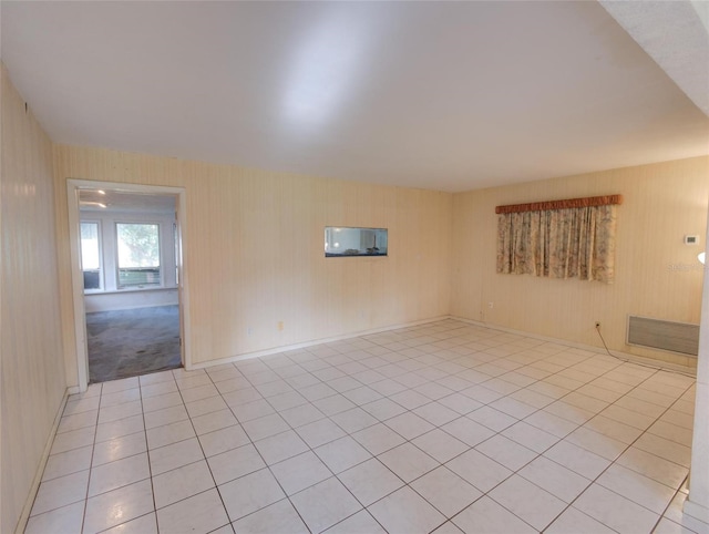 spare room featuring light tile patterned floors