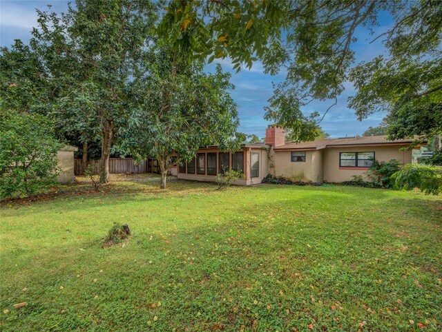 view of yard featuring a sunroom