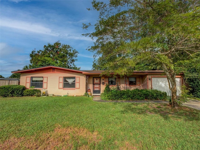 ranch-style house with a front lawn and a garage