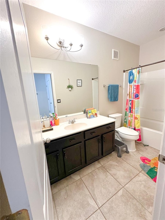 full bathroom with vanity, shower / bath combo, tile patterned flooring, toilet, and a textured ceiling