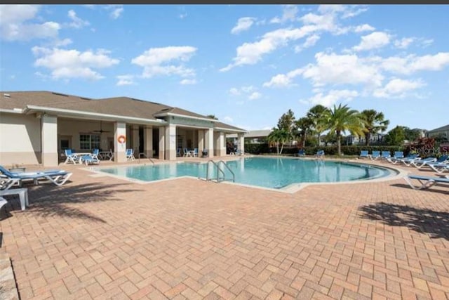 view of swimming pool with a patio