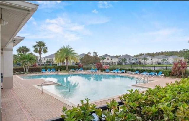 view of swimming pool with a patio