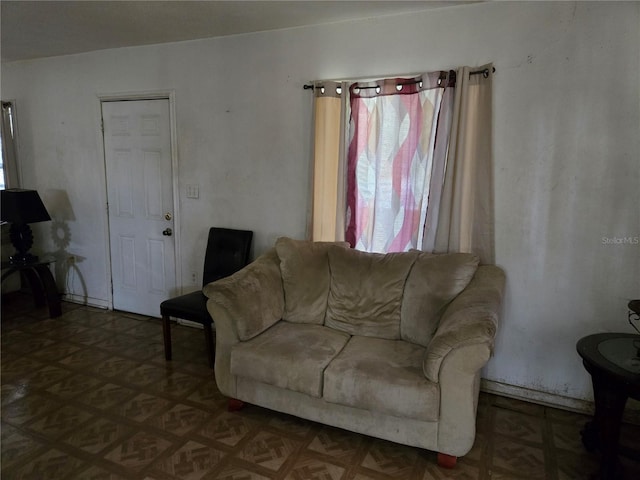 living room featuring parquet flooring