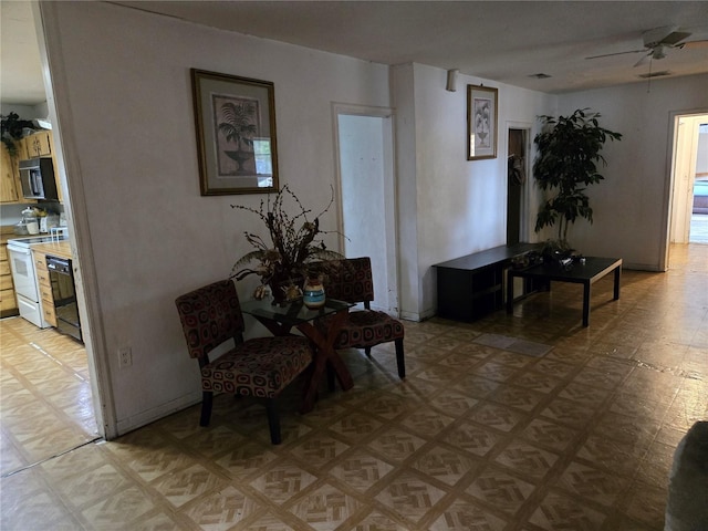 living area featuring ceiling fan