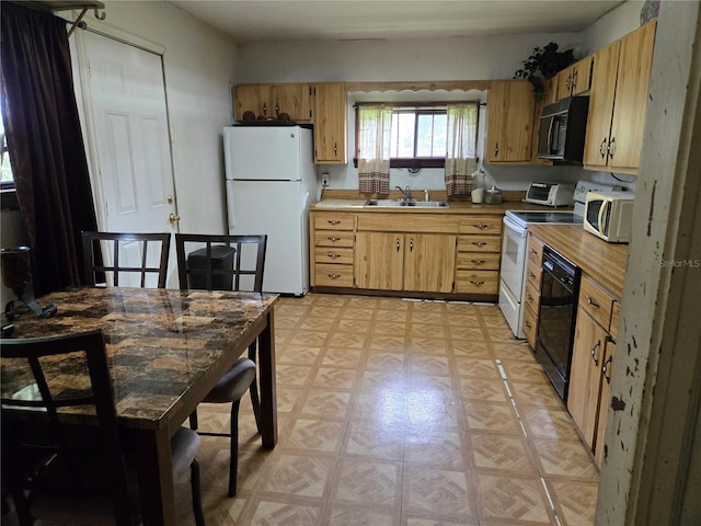 kitchen with black appliances and sink