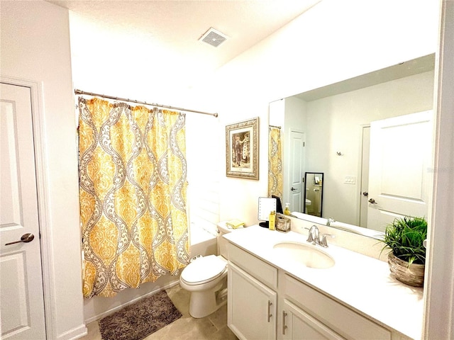 full bathroom featuring toilet, tile patterned floors, vanity, and shower / tub combo with curtain